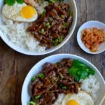 asian rice bowl with veggies and meat family sty 2026 07 23 035924 679x1024 1