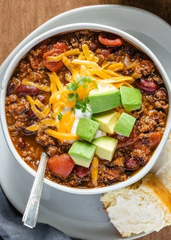 Bowl of award-winning venison chili topped with cilantro and green onions