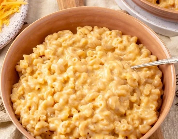 Delicious bowl of Cottage Cheese Mac and Cheese topped with herbs