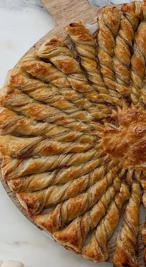 Delicious pumpkin twists with maple cream cheese filling in puff pastry