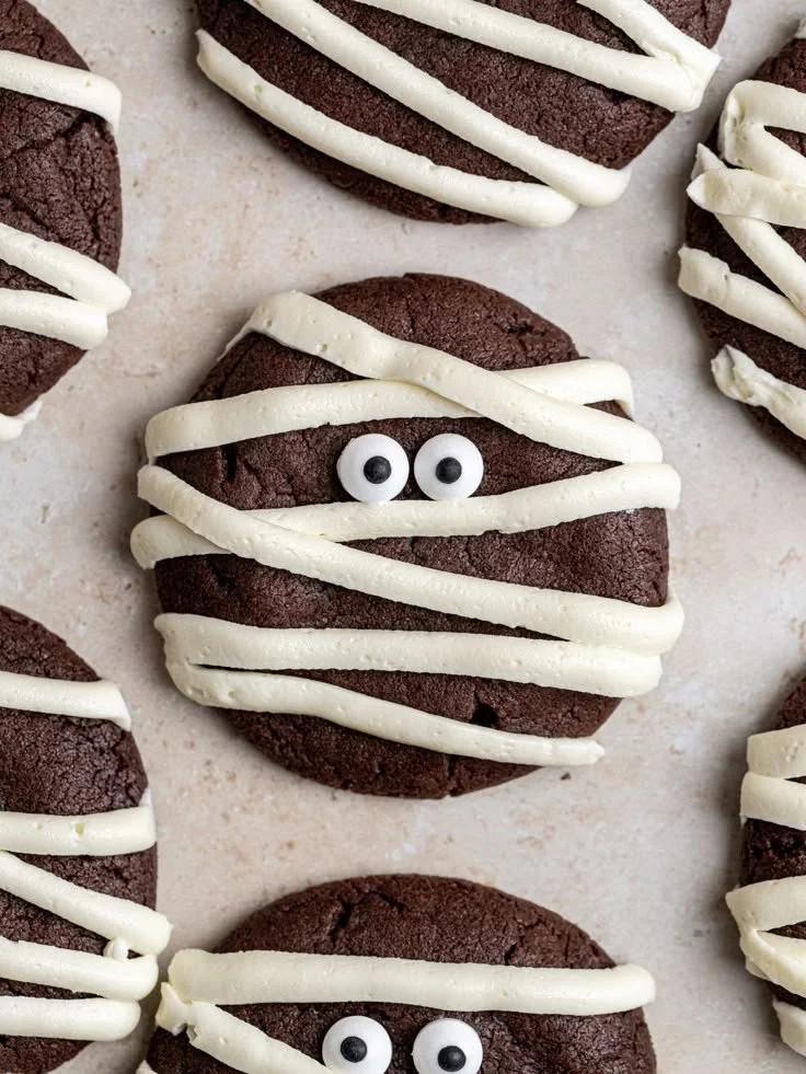 Spooky Halloween mummy cookies decorated with icing.