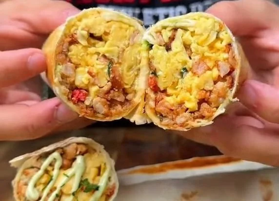 Delicious low-calorie high protein breakfast burrito filled with eggs and veggies