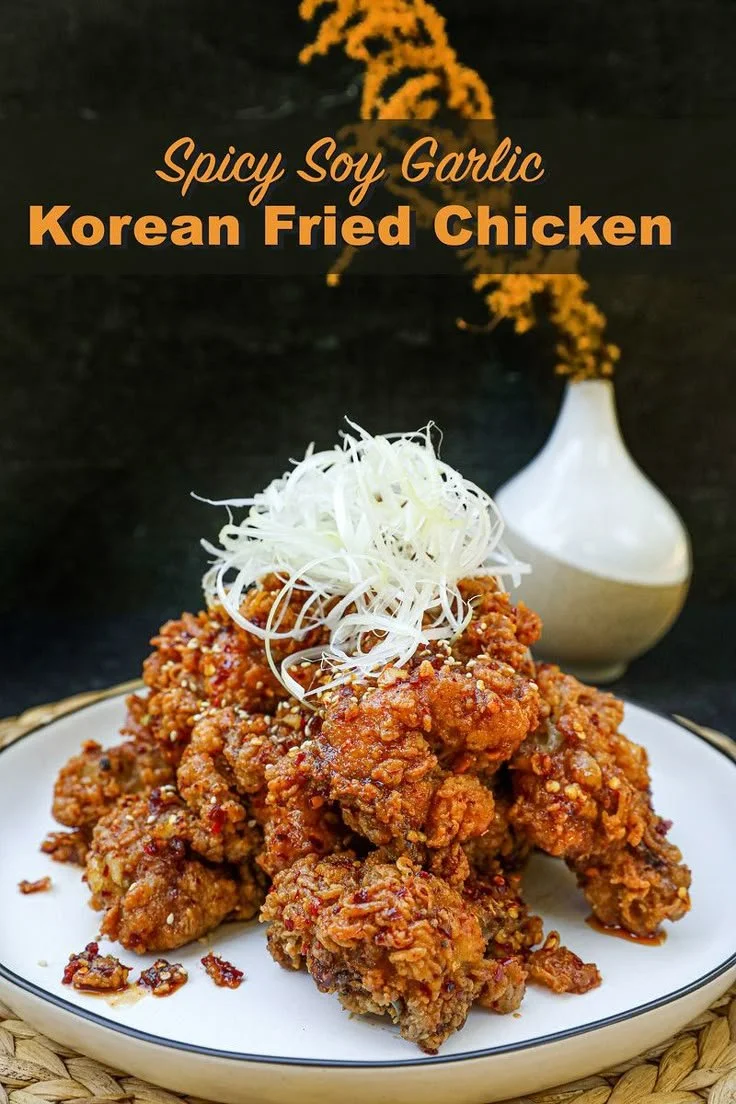 Plate of spicy garlic fried chicken with herbs and spices