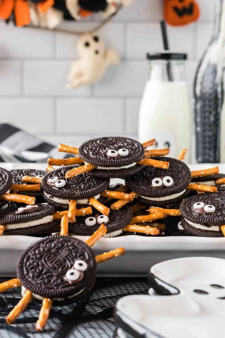 Delicious spider cookies decorated with chocolate and candy eyes for Halloween.