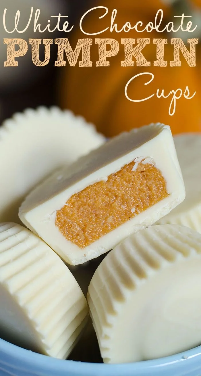 Delicious white chocolate pumpkin cups decorated with fall-themed toppings.